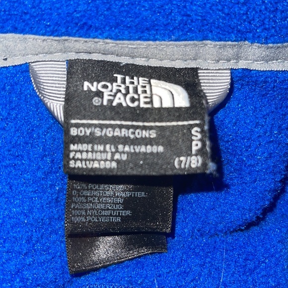 The North Face blue and black full zip jacket size 7/8 stain on front bottom - Picture 4 of 6